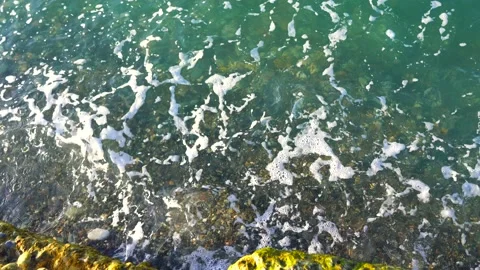 The waves hit the stone Stock Footage 153398591