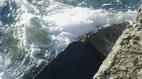 The waves hit the stone on the shore Stock Footage 157590812