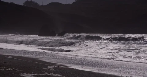 Waves hitting against the rocks and making it's way to the beach, Rodeo Beach Video stock 103447129