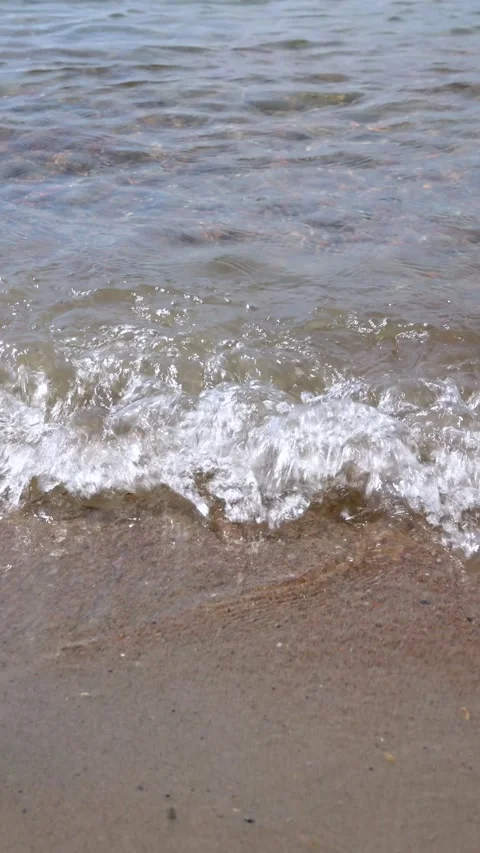 Waves hitting the beach 3 vertical Stock Footage 201684400