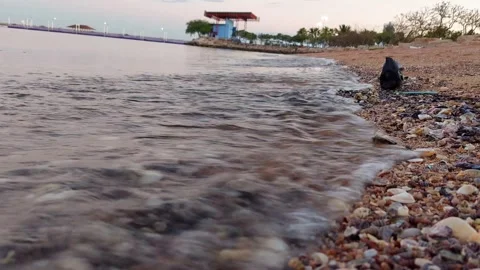 Waves hitting beautiful rocks on the beach Stock Footage 260437546