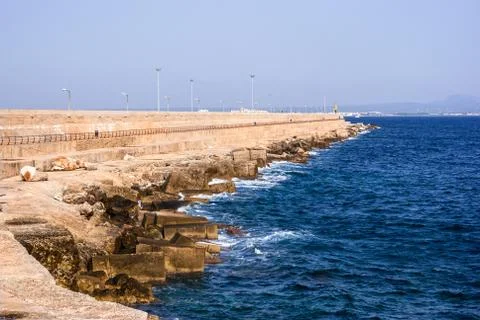 Waves hitting the breakwater Stock Photos