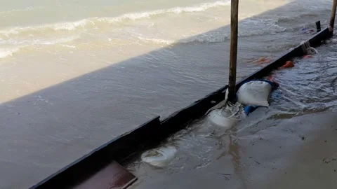 Waves hitting breakwater at seashore. 스톡 동영상 293081291