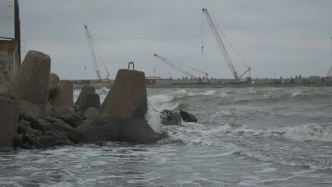 Waves hitting breakwaters in the Baltic Sea Stock Footage 147342202