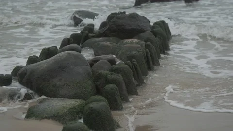 Waves hitting breakwaters in the Baltic Sea Stock Footage 147381236