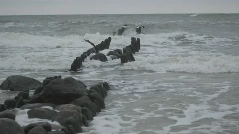 Waves hitting breakwaters in the Baltic Sea Stock Footage 147383071