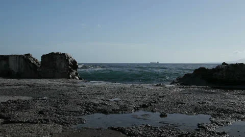 Waves hitting a broken wall with horizon Stock Footage 22813069