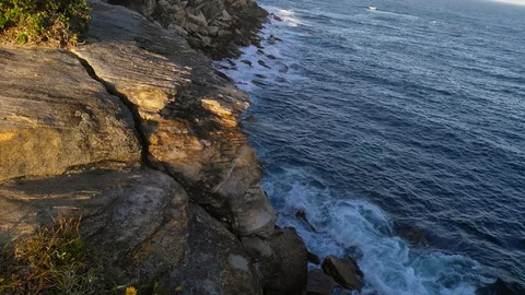Waves hitting a cliff, on a sunny summer evening, at coogee beach, in Sidney, Stock Footage 85727282
