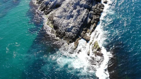 Waves hitting the cliffs on the rocky coast of the sea. Stock Footage 118774195