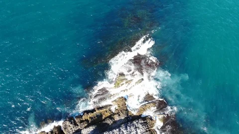 Waves hitting the cliffs on the rocky coast of the sea. Stock Footage 118775648