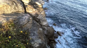 Waves hitting cliffs, on a sunny summer day, at coogee beach, in Sidney, Aust Stock Footage 85728640