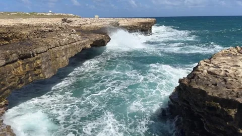 Waves hitting the coast at Devils Bridge, Antigua, Caribbean Stock Footage 304124113