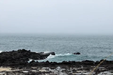 Waves hitting the coast side Stock Photos