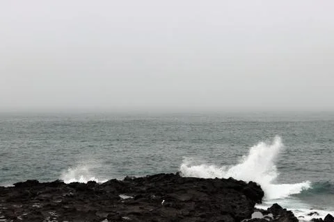 Waves hitting the coast side Stock Photos