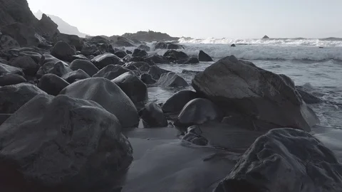 Waves hitting dark volcanic Benijo beach on sunset Video stock 122372765