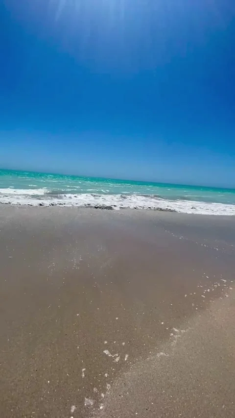 Waves hitting the empty beach Stock Footage 278597981