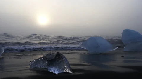 Waves Hitting Ice Rocks On The Coast Of Diamond Beach Video stock 233451458