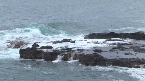 Waves Hitting Lava Rock Stock Footage 32204301