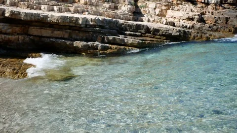 Waves hitting rock cliffs Stock Footage 112824999