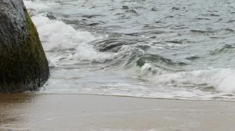 Waves hitting a rock Stock Footage 10579320