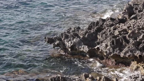 Waves hitting rock Stock Footage 127870918