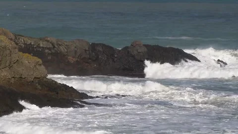 Waves hitting the rock Stock Footage 147490354