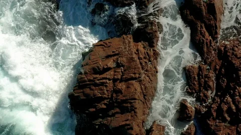 Waves hitting a rock in slow motion 2 Stock Footage 127242317
