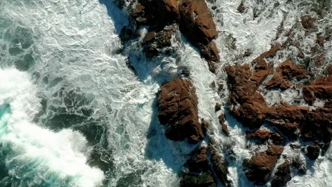 Waves hitting a rock in slow motion 3 Stock Footage 127242484