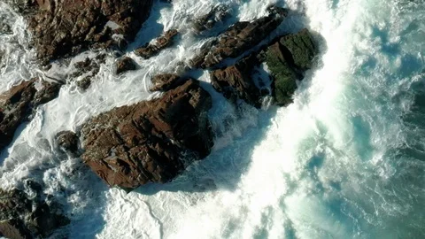 Waves hitting a rock in slow motion 4 Stock Footage 127242557
