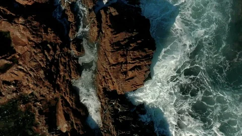 Waves hitting a rock in slow motion 5 Stock Footage 127242628