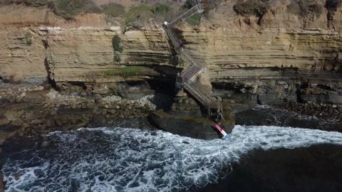 Waves hitting rocks and cliff in Sunset cliffs, San Diego Stock Footage 233428540