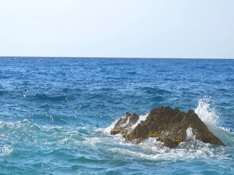 Waves Hitting Rocks Blue Ionic Sea 4K Stock Footage 78258286