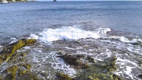 Waves hitting the rocks in Cadaqués Stock Footage 103698739