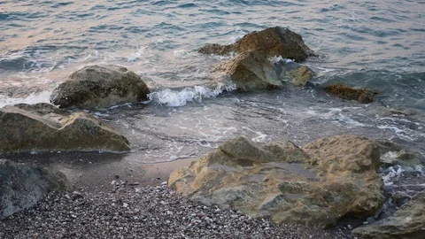Waves hitting the rocks on a coast 4k Video stock 129762739