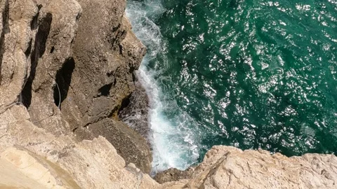 Waves Hitting Rocks on the Coastline Video stock 250027877