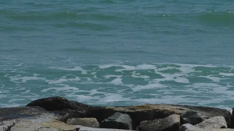 Waves hitting the rocks at coastline Stock Footage 303501069
