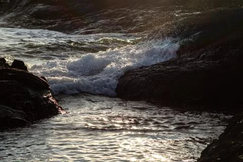 Waves hitting rocks in on the coastline Stock Photos