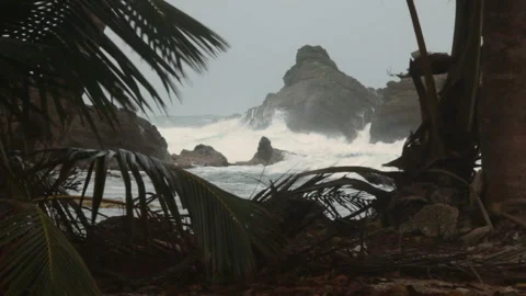 Waves hitting on rocks at the Darien Gap in Colombia Stock Footage 148390897