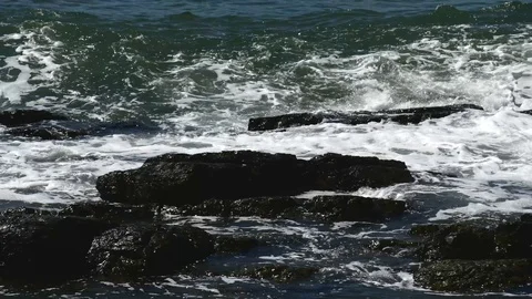 Waves hitting rocks Stock Footage 126669729