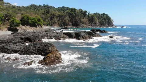 Waves hitting rocks Stock Footage 127601339