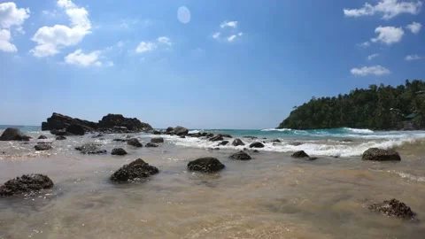 Waves hitting the rocks on Mirissa Beach, Sri Lanka Stock Footage 197055584