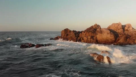 Waves Hitting Rocks in Ocean Video stock 221378163