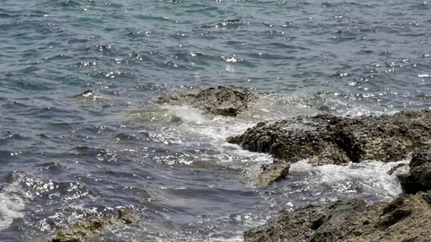 Waves hitting rocks by the ocean.Original Author: Danny Stock Footage 89163638