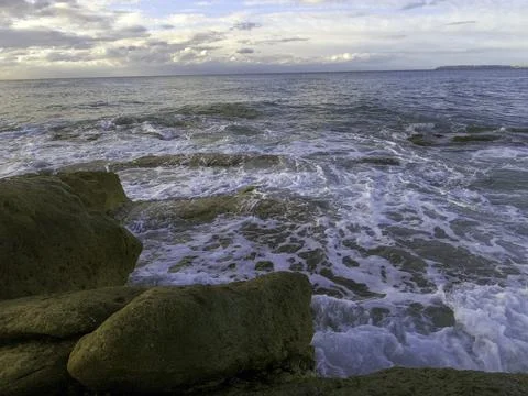Waves hitting the rocks Stock Photos