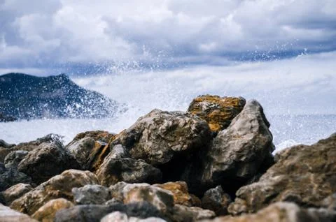 Waves hitting the rocks in port of valldemossa, majorca, balearic islands, sp Stock Photos