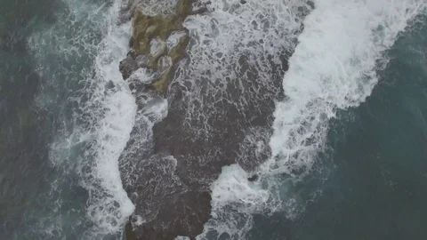 Waves hitting rocks (RAW) Stock Footage