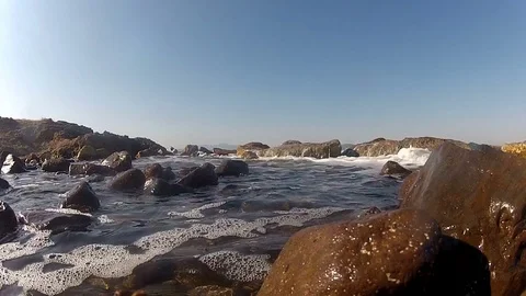 Waves hitting rocks in the sea 動画素材 74548451