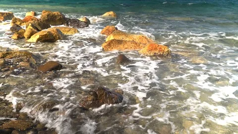 Waves hitting rocks at sea Stock Footage 127119661