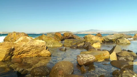 Waves hitting rocks at sea Video stock 127152034