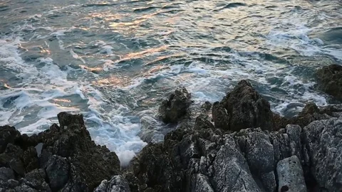 Waves hitting rocks at sea in Rovinj Croatia Video stock 76801311